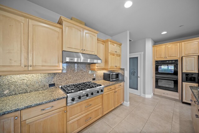 831 Santa Cruz Dr, Redding, CA 96003 - kitchen with under cabinet range hood, stainless steel appliances, light brown cabinetry, baseboards, and recessed lighting