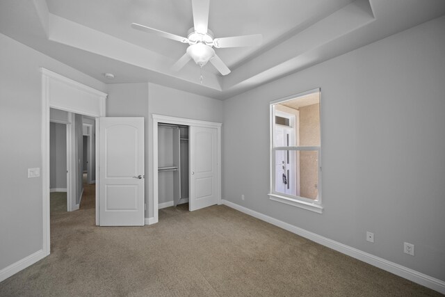 831 Santa Cruz Dr, Redding, CA 96003 - unfurnished bedroom with a raised ceiling, carpet, a closet, and baseboards