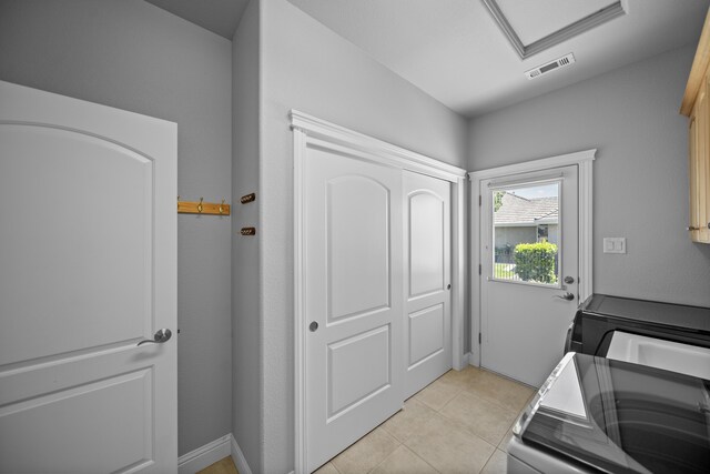 831 Santa Cruz Dr, Redding, CA 96003 - washroom featuring washing machine and dryer, attic access, and light tile patterned floors