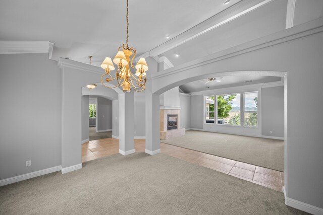 831 Santa Cruz Dr, Redding, CA 96003 - unfurnished living room with carpet flooring, tile patterned flooring, a chandelier, and ornamental molding