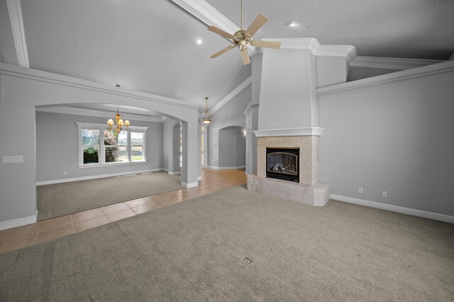 831 Santa Cruz Dr, Redding, CA 96003 - unfurnished living room with tile patterned flooring, carpet flooring, arched walkways, a chandelier, and a tiled fireplace