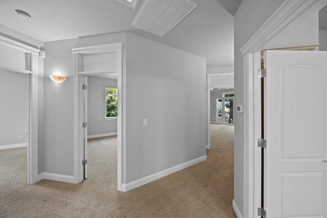 831 Santa Cruz Dr, Redding, CA 96003 - hallway with carpet, plenty of natural light, and baseboards
