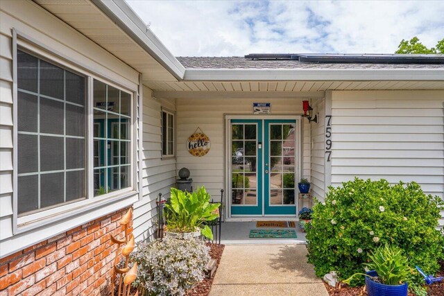 7597 Terra Linda Way, Redding, CA 96003 - entrance to property featuring french doors and roof with shingles