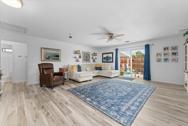 7597 Terra Linda Way, Redding, CA 96003 - living area with a ceiling fan, attic access, wood finished floors, and baseboards