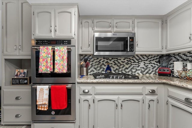 7597 Terra Linda Way, Redding, CA 96003 - kitchen featuring stainless steel appliances and decorative backsplash