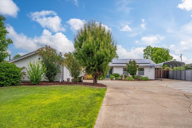7597 Terra Linda Way, Redding, CA 96003 - view of front facade featuring concrete driveway, solar panels, and a carport