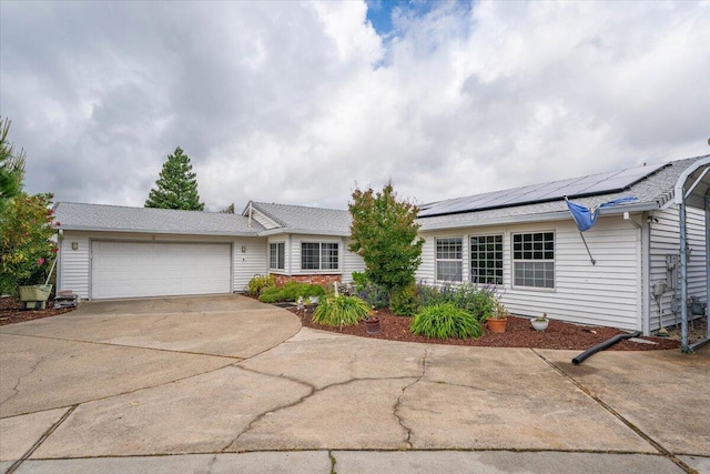 7597 Terra Linda Way, Redding, CA 96003 - single story home with concrete driveway, a garage, and solar panels