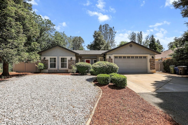 406 Spire Point Dr, Redding, CA 96003 - ranch-style home with driveway, an attached garage, fence, and stucco siding