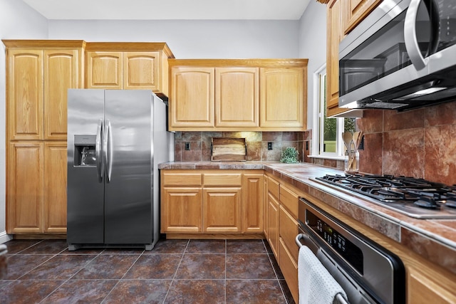 406 Spire Point Dr, Redding, CA 96003 - kitchen featuring appliances with stainless steel finishes, tasteful backsplash, and tile counters