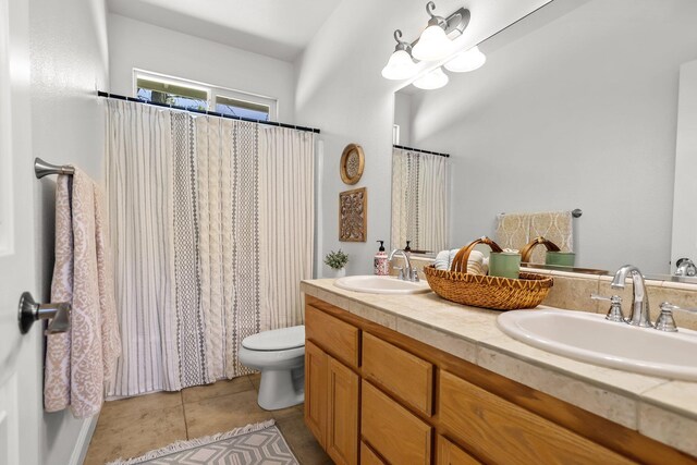406 Spire Point Dr, Redding, CA 96003 - full bathroom featuring toilet, double vanity, tile patterned floors, and a shower with curtain