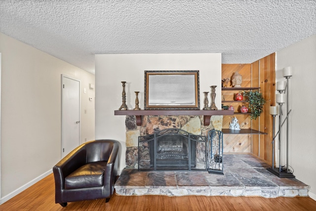 1836 Del Mar Ave, Redding, CA 96003 - living room with wood finished floors, a textured ceiling, and a fireplace