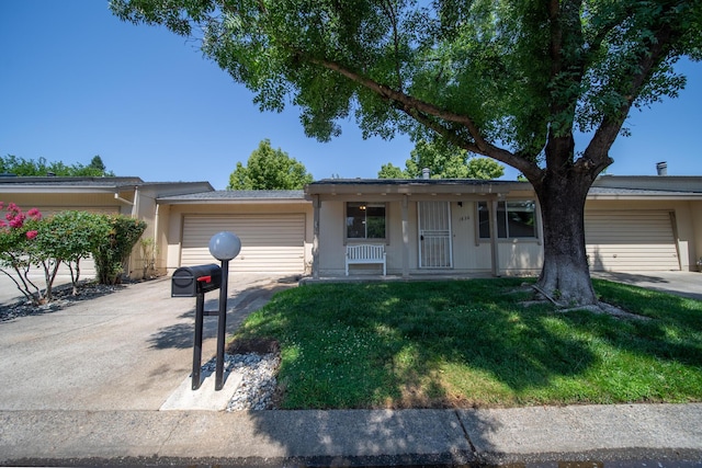 1836 Del Mar Ave, Redding, CA 96003 - ranch-style house featuring a garage, a front lawn, concrete driveway, covered porch, and stucco siding
