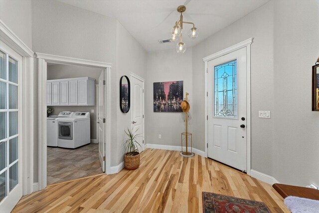 1235 Chandon Ct, Redding, CA 96003 - entryway with washer / clothes dryer, light wood-style flooring, and baseboards