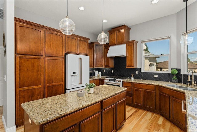 1235 Chandon Ct, Redding, CA 96003 - kitchen featuring high end appliances, a sink, custom range hood, light wood-type flooring, and recessed lighting