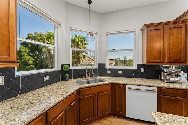 1235 Chandon Ct, Redding, CA 96003 - kitchen with dishwasher, a sink, light stone countertops, pendant lighting, and backsplash