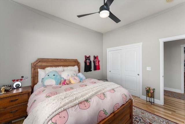 1235 Chandon Ct, Redding, CA 96003 - bedroom with a closet, wood finished floors, lofted ceiling, baseboards, and a ceiling fan