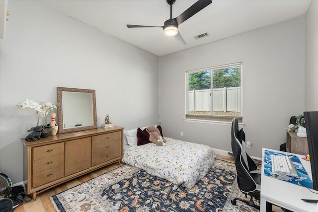 1235 Chandon Ct, Redding, CA 96003 - bedroom featuring light wood-style floors, a ceiling fan, and baseboards