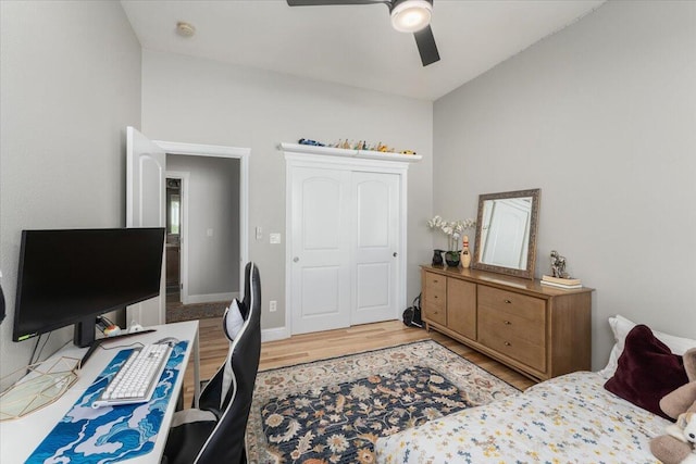 1235 Chandon Ct, Redding, CA 96003 - bedroom featuring light wood-type flooring, a ceiling fan, a closet, and baseboards