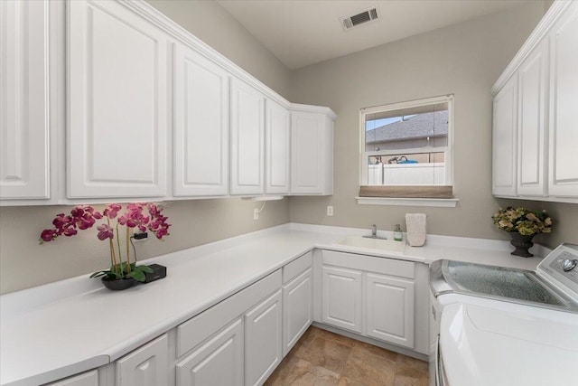 1235 Chandon Ct, Redding, CA 96003 - laundry room with cabinet space and independent washer and dryer