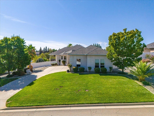 1235 Chandon Ct, Redding, CA 96003 - view of front of home with a front yard, driveway, and stucco siding
