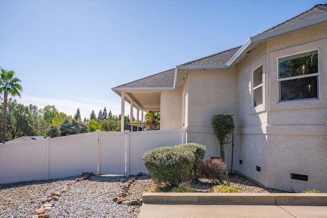 1235 Chandon Ct, Redding, CA 96003 - view of side of home with roof with shingles and stucco siding