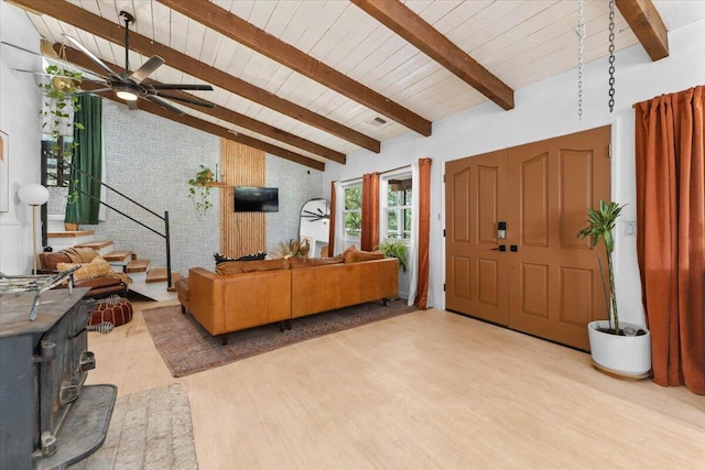 19697 Old Indian Trl, Redding, CA 96003 - foyer entrance with wood finished floors, a ceiling fan, wood ceiling, a wood stove, and stairs