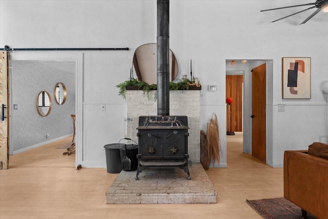 19697 Old Indian Trl, Redding, CA 96003 - detailed view of a wood stove, wood finished floors, and a ceiling fan