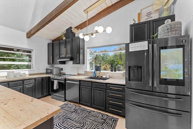 19697 Old Indian Trl, Redding, CA 96003 - kitchen with stainless steel appliances, a sink, light countertops, and plenty of natural light