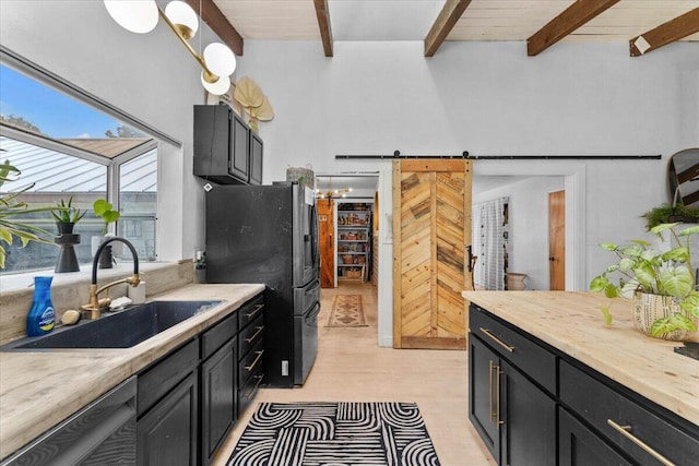 19697 Old Indian Trl, Redding, CA 96003 - kitchen featuring a sink, freestanding refrigerator, beamed ceiling, dishwasher, and light countertops