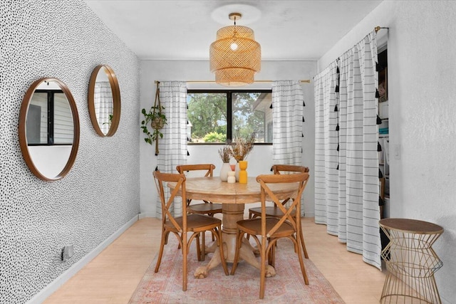 19697 Old Indian Trl, Redding, CA 96003 - dining space featuring light wood-style flooring, a textured wall, and baseboards