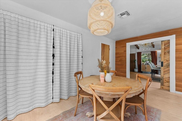 19697 Old Indian Trl, Redding, CA 96003 - dining space with light wood-style flooring and wood walls