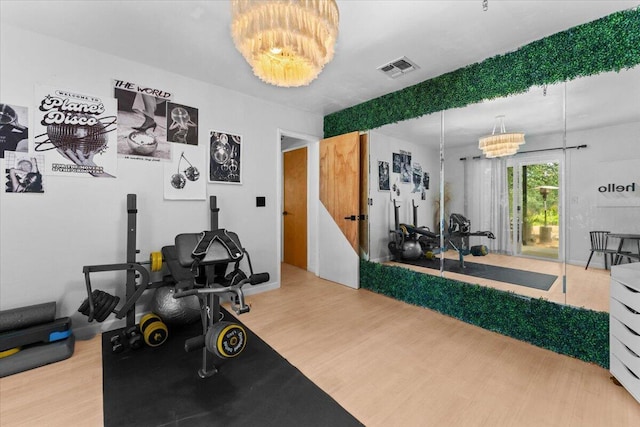 19697 Old Indian Trl, Redding, CA 96003 - workout room featuring wood finished floors and a chandelier