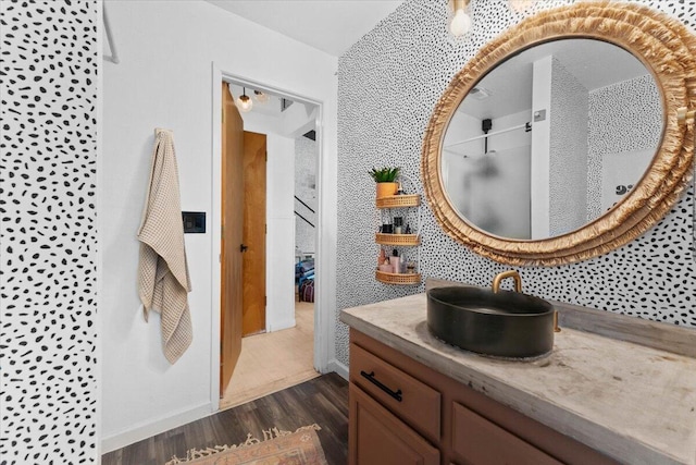19697 Old Indian Trl, Redding, CA 96003 - bathroom featuring wood finished floors, vanity, and baseboards
