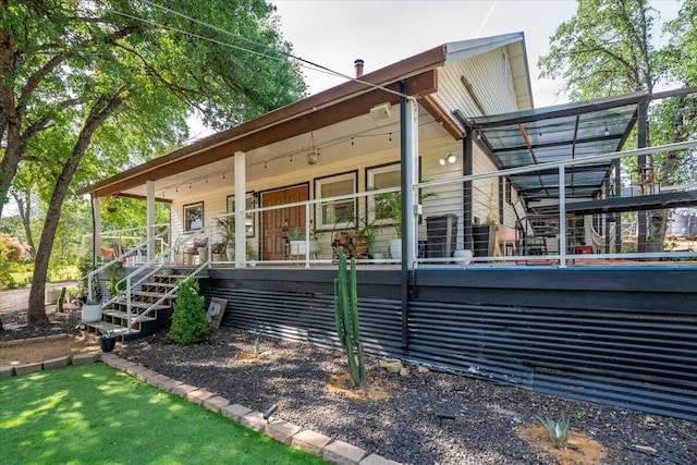19697 Old Indian Trl, Redding, CA 96003 - back of property with covered porch and stairway