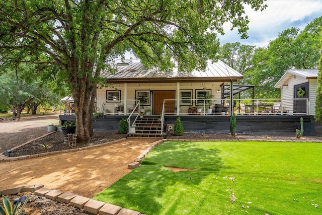 19697 Old Indian Trl, Redding, CA 96003 - view of front of house with a porch, a standing seam roof, metal roof, and a front lawn