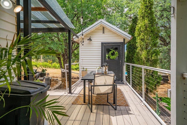19697 Old Indian Trl, Redding, CA 96003 - wooden terrace with outdoor dining area and an outbuilding