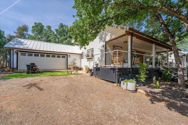 19697 Old Indian Trl, Redding, CA 96003 - view of front of house with dirt driveway, metal roof, and an outdoor structure