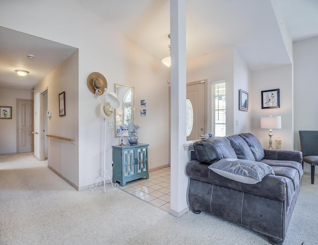 tiled living room with carpet flooring and baseboards