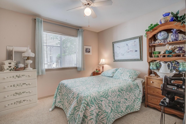 bedroom featuring carpet flooring, a ceiling fan, and baseboards