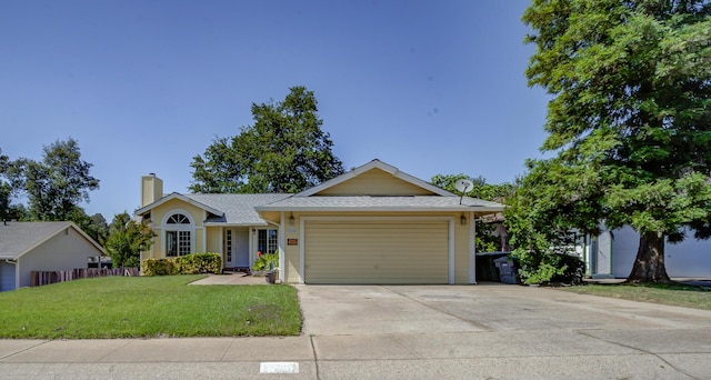 ranch-style home featuring a chimney, a front lawn, a garage, concrete driveway, and roof with shingles