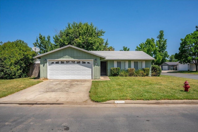 2682 Marvin Trl, Redding, CA 96001 - ranch-style house featuring concrete driveway, a garage, and a front lawn