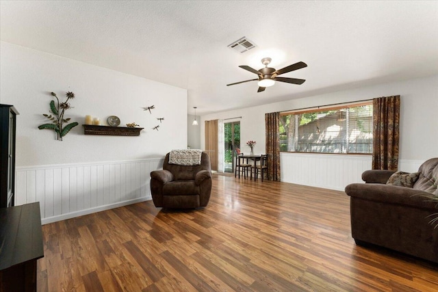 2682 Marvin Trl, Redding, CA 96001 - living room with wood finished floors, a ceiling fan, and a wainscoted wall