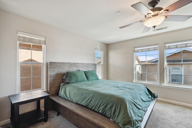 bedroom featuring carpet floors, baseboards, and a ceiling fan