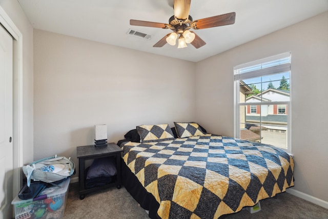 bedroom with carpet floors, baseboards, a closet, and ceiling fan