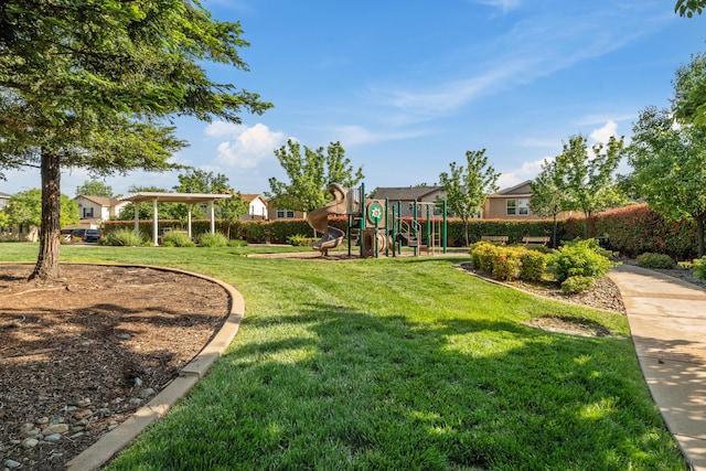 view of green lawn with a residential view