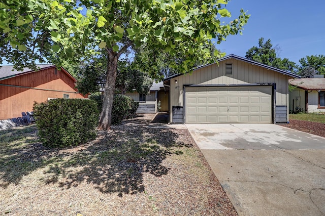 view of front of house featuring concrete driveway and a garage