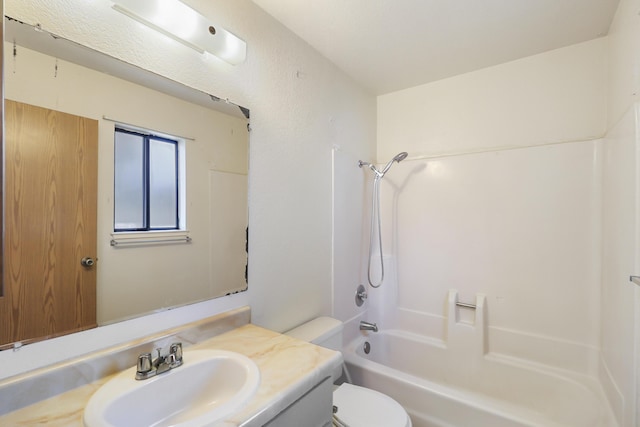 full bathroom featuring toilet, vanity, and bathtub / shower combination