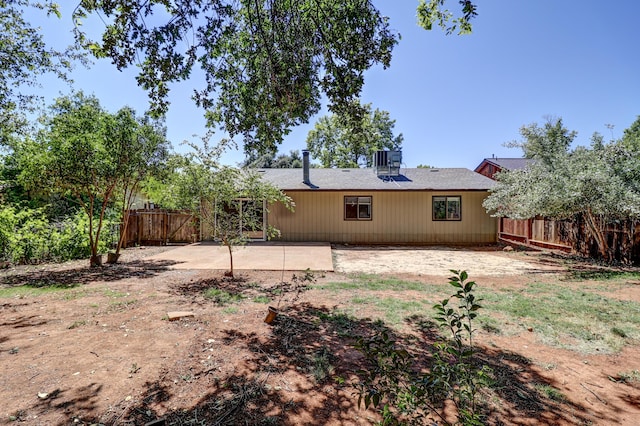 back of house with fence and a patio