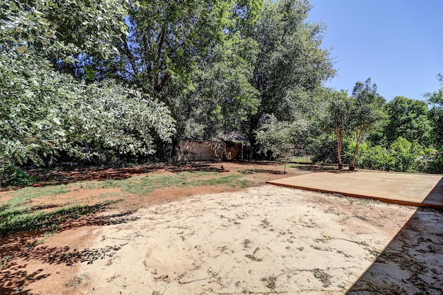 view of yard with fence and a patio area