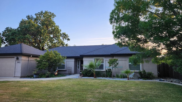3621 Sacramento Dr, Redding, CA 96001 - single story home with a front yard, stucco siding, and an attached garage